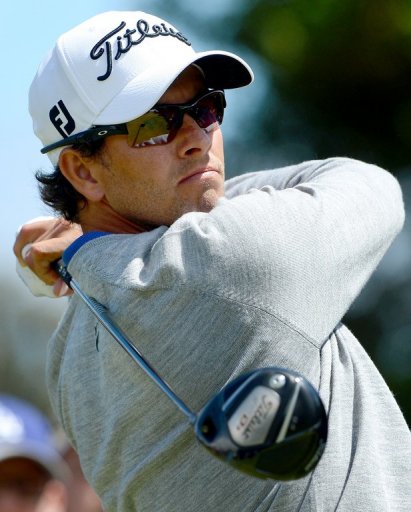 Home favourite, Adam Scott, tees off during the third round of the Australian Masters Home favourite, Adam Scott, tees off during the third round of the Australian Masters