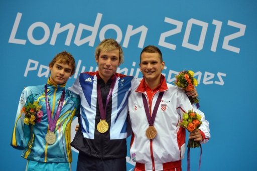 Ukraine's silver medallist Yevheniy Bohodayko (left) poses on the podium Ukraine's silver medallist Yevheniy Bohodayko (left) poses on the podium