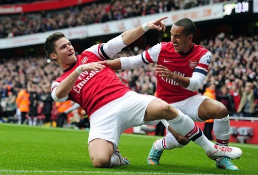 Arsenal's Olivier Giroud (L) celebrates scoring their third goal with Theo Walcott Arsenal's Olivier Giroud (L) celebrates scoring their third goal with Theo Walcott