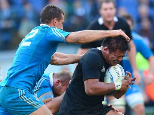 All Blacks hooker Keven Mealamu (R) is tackled by Italy's centre Alberto Sgarbi All Blacks hooker Keven Mealamu (R) is tackled by Italy's centre Alberto Sgarbi