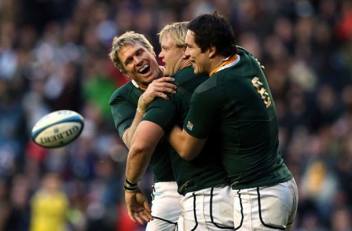 South Africa's Adriaan Strauss (C) celebrates with Jean de Villiers (L) and Francois Louw after scoring his second try South Africa's Adriaan Strauss (C) celebrates with Jean de Villiers (L) and Francois Louw after scoring his second try