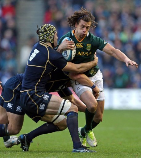 Scotland flanker Kelly Brown (L) tackles South Africa's full back Zane Kirchner Scotland flanker Kelly Brown (L) tackles South Africa's full back Zane Kirchner