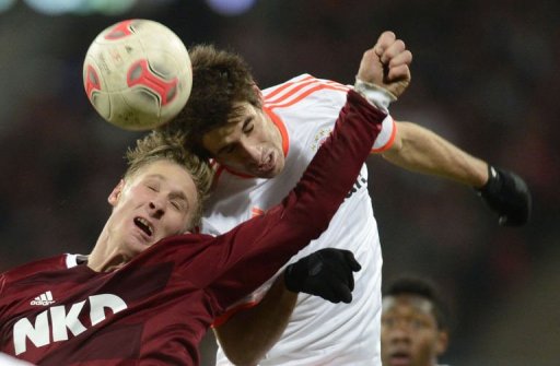 Bayern Munich's midfielder Javi Martinez (R) and Nuremberg's striker Sebastian Polter challenge for the ball Bayern Munich's midfielder Javi Martinez (R) and Nuremberg's striker Sebastian Polter challenge for the ball