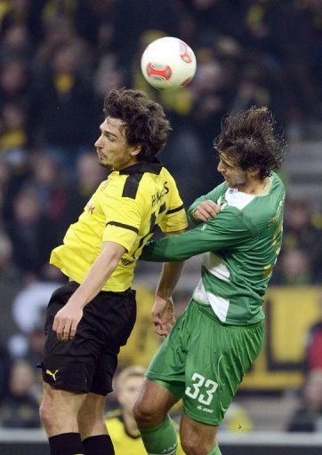 Dortmund's defender Mats Hummels (L) and Fuerth's Kosovan forward Ilir Azemi jump for the ball Dortmund's defender Mats Hummels (L) and Fuerth's Kosovan forward Ilir Azemi jump for the ball