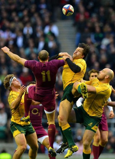 England wing Charlie Sharples (2nd L) jumps for the ball against Australia centre Adam Ashley-Cooper (2nd R) England wing Charlie Sharples (2nd L) jumps for the ball against Australia centre Adam Ashley-Cooper (2nd R)
