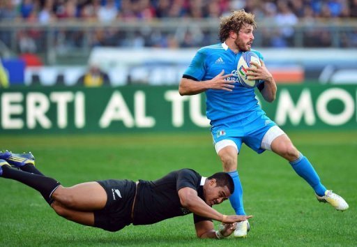 Italy's winger Mirco Bergamasco (R) is tackled by New Zealand All Blacks winger Hosea Gear Italy's winger Mirco Bergamasco (R) is tackled by New Zealand All Blacks winger Hosea Gear