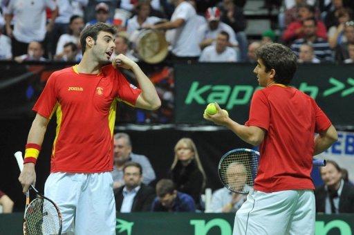Spanish tennis player Marcel Granollers (L) talks with his teammate Marc Lopez Spanish tennis player Marcel Granollers (L) talks with his teammate Marc Lopez
