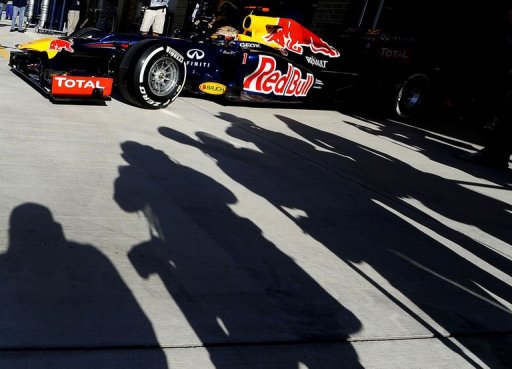 Germany's Sebastian Vettel of Red Bull racing drives out of the pits Germany's Sebastian Vettel of Red Bull racing drives out of the pits