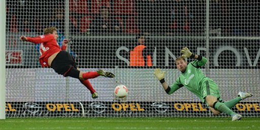 Leverkusen's striker Stefan Kiessling (L) scores past Schalke's goalkeeper Lars Unnerstall Leverkusen's striker Stefan Kiessling (L) scores past Schalke's goalkeeper Lars Unnerstall