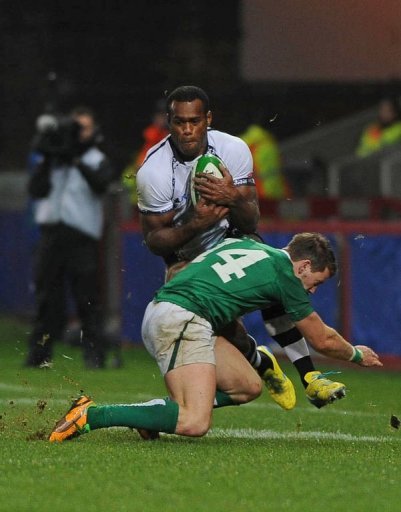 Ireland wing Craig Gilroy tackles Fiji wing Simeli Koniferedi (L) Ireland wing Craig Gilroy tackles Fiji wing Simeli Koniferedi (L)