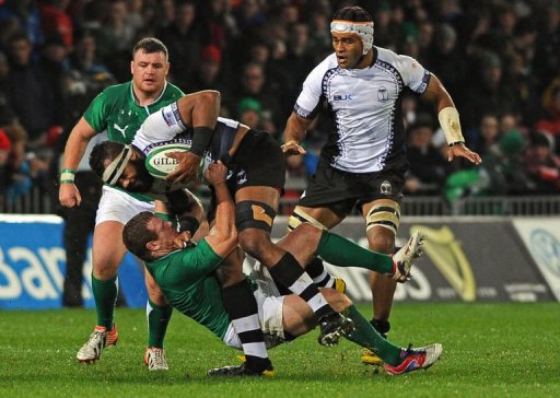 Ireland's hooker Sean Cronin tackles Fiji's lock Apisai Naikatini (up) Ireland's hooker Sean Cronin tackles Fiji's lock Apisai Naikatini (up)