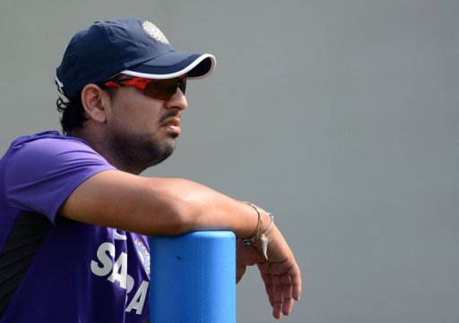 Indian cricketer Yuvraj Singh watches teammates during a training session on November 14 Indian cricketer Yuvraj Singh watches teammates during a training session on November 14