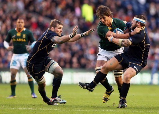 Scotland's flanker John Barclay (L) and prop Ryan Grant (R) tackle South Africa's lock Eben Etzebeth (C) Scotland's flanker John Barclay (L) and prop Ryan Grant (R) tackle South Africa's lock Eben Etzebeth (C)