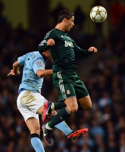 Manchester City's Pablo Zabaleta (L) jumps with Real Madrid's Cristiano Ronaldo Manchester City's Pablo Zabaleta (L) jumps with Real Madrid's Cristiano Ronaldo