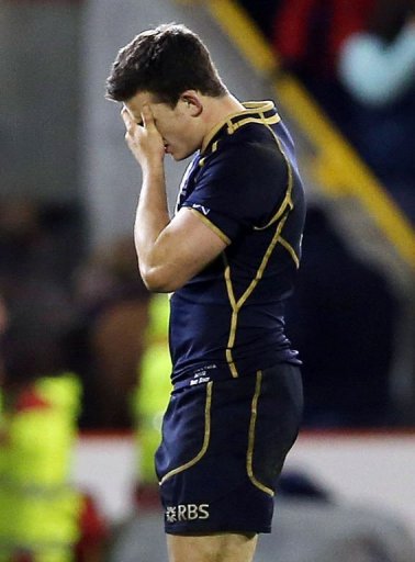 Dejected Scotland player Matthew Scott Dejected Scotland player Matthew Scott