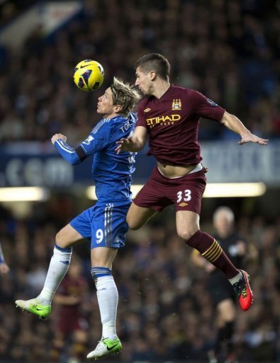 Chelsea's Fernando Torres (L) vies for the ball against Manchester City's Matija Nastasic Chelsea's Fernando Torres (L) vies for the ball against Manchester City's Matija Nastasic