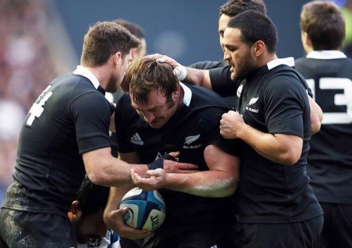 New Zealand players congratulate teammate Andrew Hore (C) on November 11 New Zealand players congratulate teammate Andrew Hore (C) on November 11