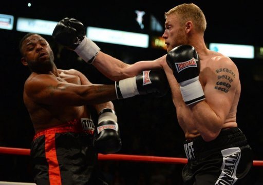 Former England cricket captain Andrew Flintoff (R) fights American Richard Dawson Former England cricket captain Andrew Flintoff (R) fights American Richard Dawson