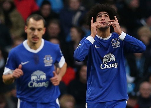 Everton's striker Marouane Fellaini celebrates (R) scoring Everton's striker Marouane Fellaini celebrates (R) scoring