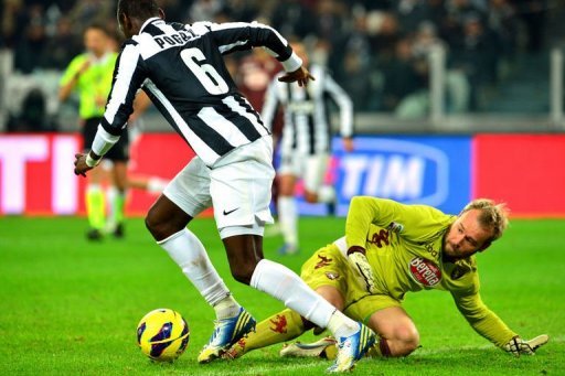 Juventus' midfielder Paul Pogba (L) fights for the ball with Torino's goalkeeper Jean Francois Gillet Juventus' midfielder Paul Pogba (L) fights for the ball with Torino's goalkeeper Jean Francois Gillet