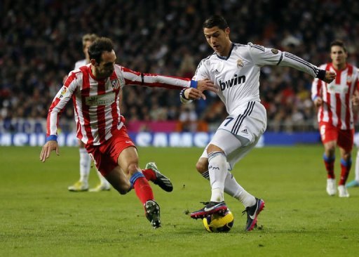 Real Madrid's Cristiano Ronaldo (R) responded on 15 minutes with a free-kick from 30 yards which nestled in the corner Real Madrid's Cristiano Ronaldo (R) responded on 15 minutes with a free-kick from 30 yards which nestled in the corner