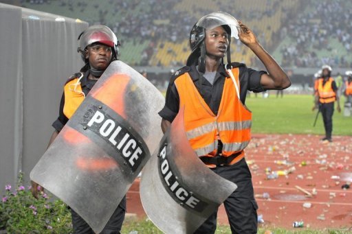 The match was initially suspended for about 40 minutes as stones, bottles and chairs rained down on Ivory Coast players The match was initially suspended for about 40 minutes as stones, bottles and chairs rained down on Ivory Coast players