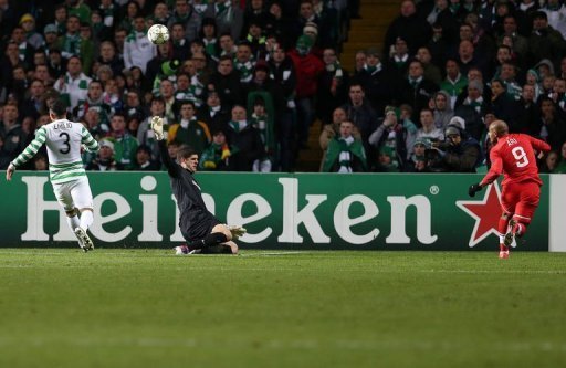 Spartak Moscow's Ari (L) chips the ball over Celtic's Fraser Forster (C) to score Spartak Moscow's Ari (L) chips the ball over Celtic's Fraser Forster (C) to score