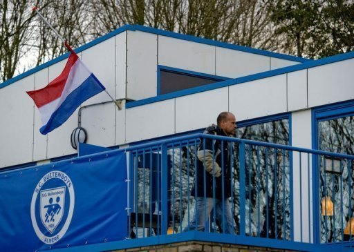 A flag flies at half-mast on December 4 at the clubhouse of the Dutch football club SC Buitenboys in Almere A flag flies at half-mast on December 4 at the clubhouse of the Dutch football club SC Buitenboys in Almere