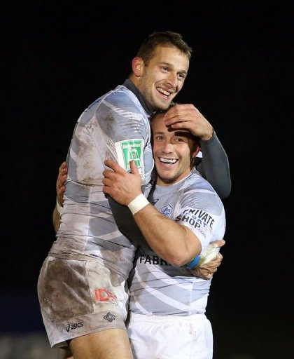 Castres players Romain Martial (L) and Marc Andreu celebrate following their victory Castres players Romain Martial (L) and Marc Andreu celebrate following their victory