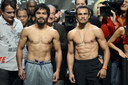 Manny Pacquiao (L) and Juan Manuel Marquez pose during the official weigh-in Manny Pacquiao (L) and Juan Manuel Marquez pose during the official weigh-in