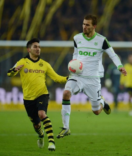 Wolfsburg's striker Bas Dost (R) and Dortmund's midfielder Ilkay Guendogan fight for the ball Wolfsburg's striker Bas Dost (R) and Dortmund's midfielder Ilkay Guendogan fight for the ball