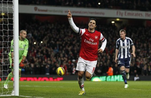 Arsenal's midfielder Mikel Arteta celebrates scoring his second penalty Arsenal's midfielder Mikel Arteta celebrates scoring his second penalty
