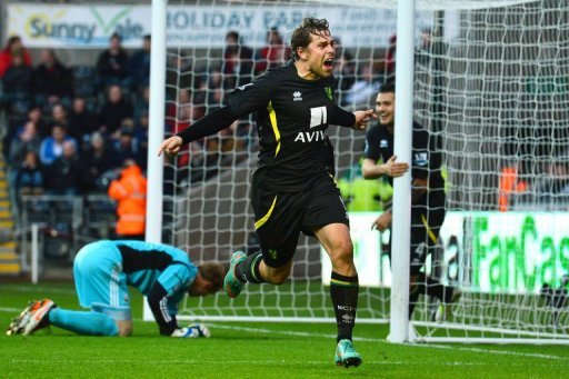 Norwich City's striker Grant Holt (C) celebrates after scoring their third goal Norwich City's striker Grant Holt (C) celebrates after scoring their third goal