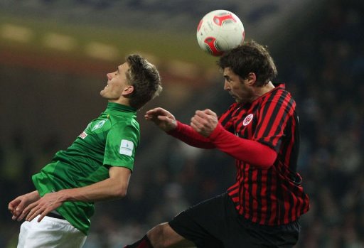 Frankfurt's Heiko Butscher (R) and Bremen's Nils Petersen jump for the ball Frankfurt's Heiko Butscher (R) and Bremen's Nils Petersen jump for the ball