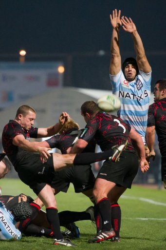 Racing-Metro's flanker Antoine Battut (R) tries to block Edinburgh's scrum-half Richie Rees Racing-Metro's flanker Antoine Battut (R) tries to block Edinburgh's scrum-half Richie Rees