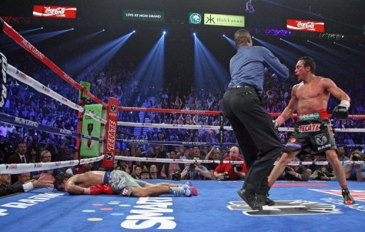 Marquez ended the fight with a overhand right that hit Pacquiao flush, sending him down hard Marquez ended the fight with a overhand right that hit Pacquiao flush, sending him down hard