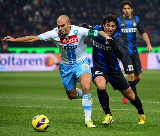 Inter Milan's Diego Milito (R) fights for the ball with Napoli's Paolo Cannavaro Inter Milan's Diego Milito (R) fights for the ball with Napoli's Paolo Cannavaro