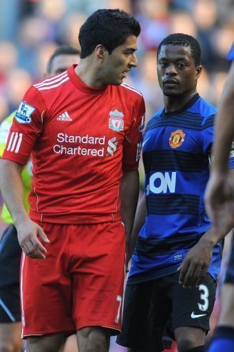 Luis Suarez (L) was hit with an eight-match suspension last year for racially abusing Patrice Evra (R) Luis Suarez (L) was hit with an eight-match suspension last year for racially abusing Patrice Evra (R)
