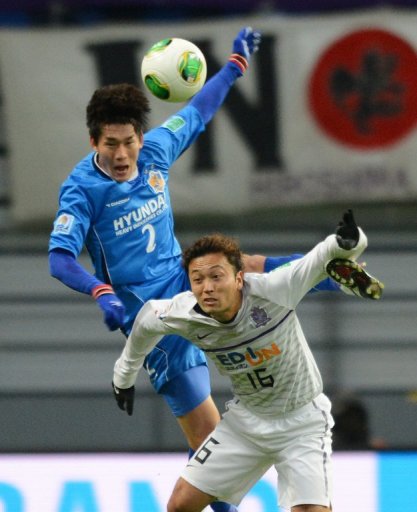 Satoru Yamagishi (below) and Lee Yong (top) both scored during Hiroshima's match against Ulsan Hyundai today Satoru Yamagishi (below) and Lee Yong (top) both scored during Hiroshima's match against Ulsan Hyundai today