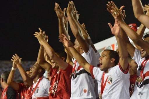 Sao Paulo players cheer as they are awarded victory in the Copa Sudamericana final in Sao Paulo on December 12, 2012 Sao Paulo players cheer as they are awarded victory in the Copa Sudamericana final in Sao Paulo on December 12, 2012
