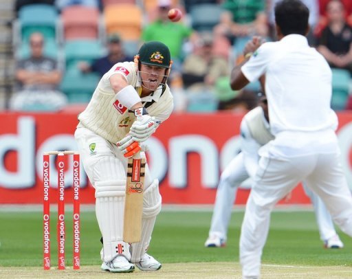 Australian batsman David Warner hits the ball back to Sri Lankan bowler Nuwan Kulasekara in Hobart on December 14, 2012 Australian batsman David Warner hits the ball back to Sri Lankan bowler Nuwan Kulasekara in Hobart on December 14, 2012