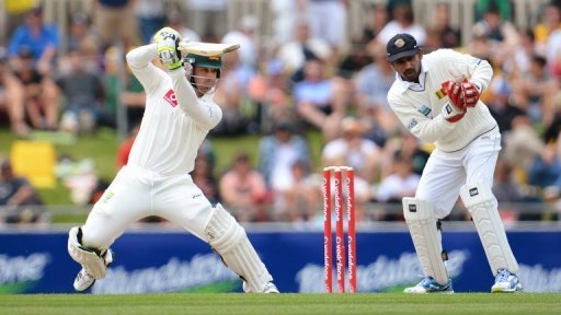 Australian batsman Phil Hughes (L) cuts a ball during the first day of the first Test in Hobart on December 14, 2012 Australian batsman Phil Hughes (L) cuts a ball during the first day of the first Test in Hobart on December 14, 2012