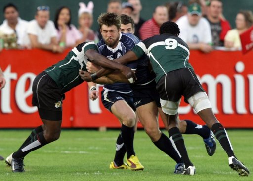 David Tait (C) fends off several Zimbabwe players at the IRB World Sevens Series in Dubai on December 4, 2009 David Tait (C) fends off several Zimbabwe players at the IRB World Sevens Series in Dubai on December 4, 2009