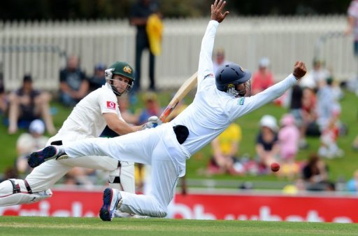 Sri Lanka's Dimuth Karunaratne (right) attempts a catch by Australia's Matthew Wade, in Hobart, on December 15 Sri Lanka's Dimuth Karunaratne (right) attempts a catch by Australia's Matthew Wade, in Hobart, on December 15