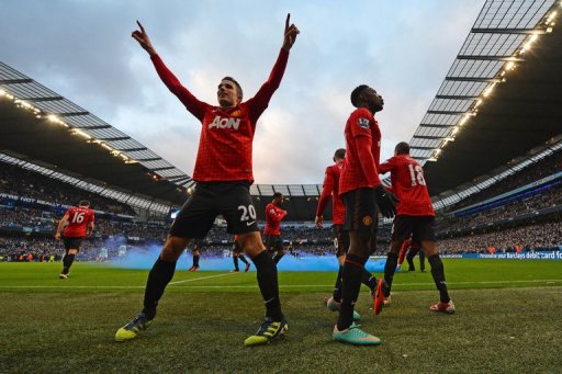 Man United's players celebrate Robin Van Persie's (L) goal against Man City, at the Etihad stadium, on December 9, 2012 Man United's players celebrate Robin Van Persie's (L) goal against Man City, at the Etihad stadium, on December 9, 2012