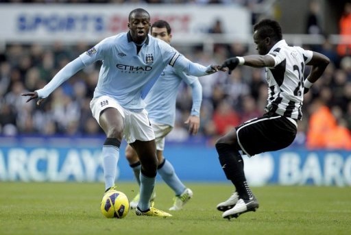 Newcastle United's Cheick Tiote (R) and Manchester City's Yaya Toure play in Newcastle, England on December 15, 2012 Newcastle United's Cheick Tiote (R) and Manchester City's Yaya Toure play in Newcastle, England on December 15, 2012