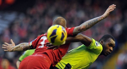 Aston Villa's Christian Benteke (R) and Liverpool's Martin Skrtel compete in Liverpool on December 15, 2012 Aston Villa's Christian Benteke (R) and Liverpool's Martin Skrtel compete in Liverpool on December 15, 2012
