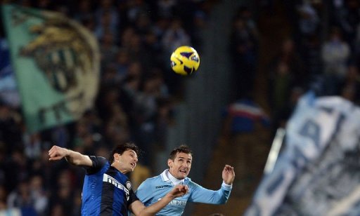 Lazio's forward Miroslav Klose (R) jumps for the ball with Inter Milan's defender Andrea Ranocchia on December 15, 2012 Lazio's forward Miroslav Klose (R) jumps for the ball with Inter Milan's defender Andrea Ranocchia on December 15, 2012