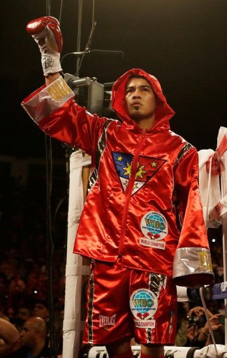 Nonito Donaire waves to the crowd before his WBO super bantamweight title bout vs Jorge Arce, on December 15, 2012 Nonito Donaire waves to the crowd before his WBO super bantamweight title bout vs Jorge Arce, on December 15, 2012