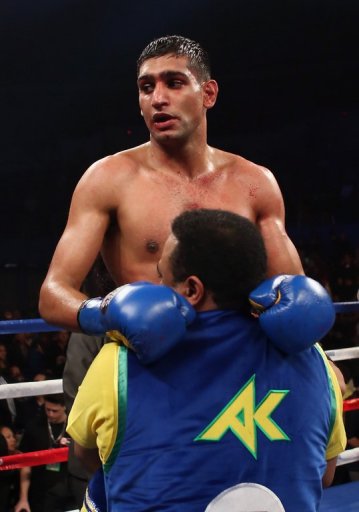 Amir Khan celebrates his victory over Carlos Molina, on December 15, 2012 Amir Khan celebrates his victory over Carlos Molina, on December 15, 2012